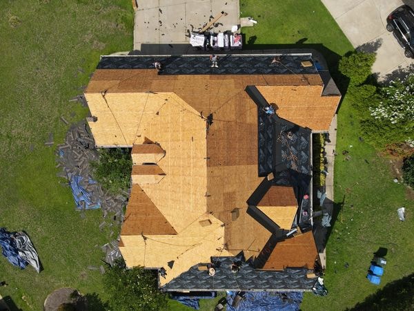 Before and after roof replacement by Calvary Roofing